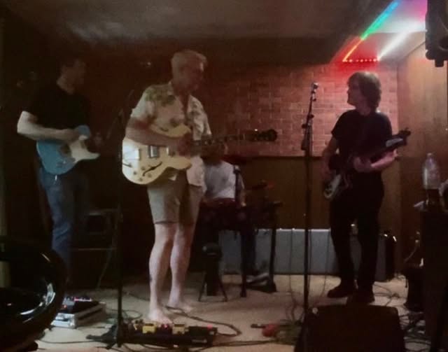 Abbey Cats rehearsing together in an intimate venue